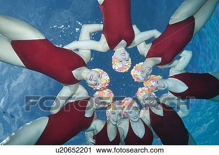 Synchronised swimmers in 1950s swimming caps View Large Photo Image Stock Image - Synchronised swimmers in 1950s swimming caps. Fotosearch