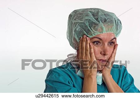 Theatre nurse considering surgery View Large Photo Image Stock Photography - Theatre nurse considering surgery. Fotosearch