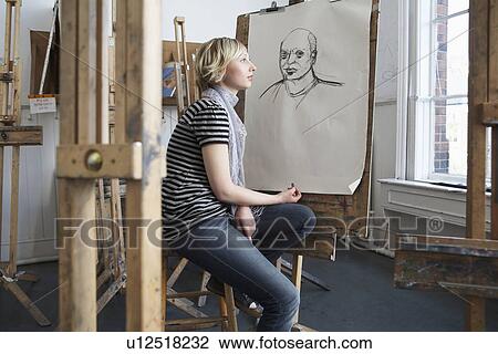 Thoughtful student by charcoal portrait in art school View Large Photo Image Stock Image - Thoughtful student by charcoal portrait in art school. Fotosearch