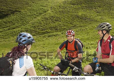 Three cyclists in countryside View Large Photo Image Stock Photography - Three cyclists in countryside. Fotosearch