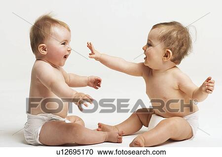 Stock Image - Two Babies Playing. Fotosearch