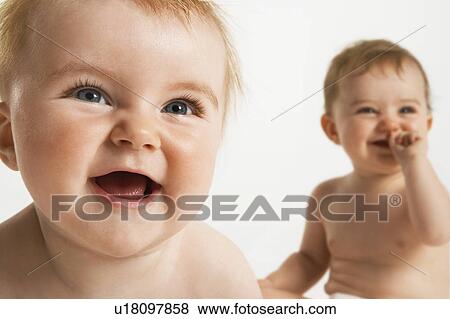 Stock Photo - Two baby girls laughing. Fotosearch