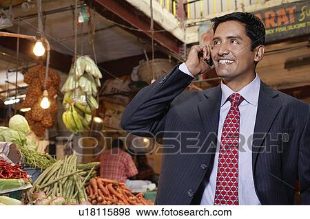Two business women smiling in city View Large Photo Image Stock Photo - Two business women smiling in city. Fotosearch