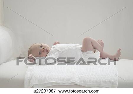 Two week old newborn baby View Large Photo Image Stock Photo - Two week old newborn baby. Fotosearch