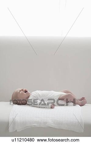 Two week old newborn, crying View Large Photo Image Stock Image - Two week old newborn, crying. Fotosearch