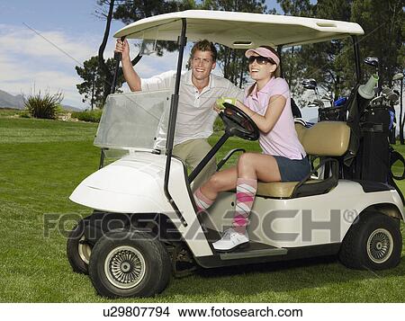 Two young golfers in cart View Large Photo Image Picture - Two young golfers in cart. Fotosearch