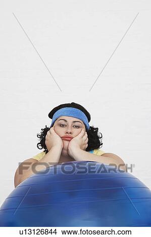 Uninspired overweight Woman Resting on Exercise Ball, portrait View Large Photo Image Picture - Uninspired overweight Woman Resting on Exercise Ball, portrait. Fotosearch