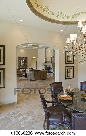 View through archway from dining room with ceiling detail View Large Photo Image Stock Photograph - View through archway from dining room with ceiling detail. Fotosearch