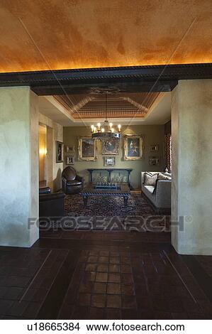 Picture - View through paint effect walls to darkly lit drawing room. Fotosearch