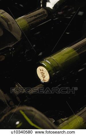 Wine bottles lying down in order View Large Photo Image Stock Image - Wine bottles lying down in order. Fotosearch