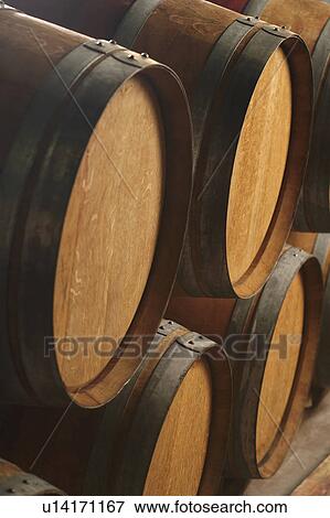 Wine casks lying down in order View Large Photo Image Stock Photo - Wine casks lying down in order. Fotosearch
