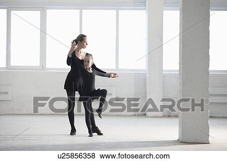 Woman and girl practise dance moves View Large Photo Image Stock Photo - Woman and girl practise dance moves. Fotosearch