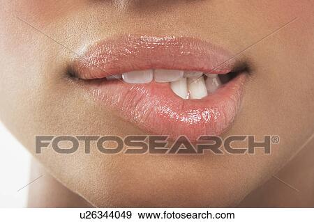 Stock Photo - Woman biting lip. Fotosearch