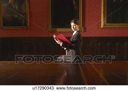 Stock Image - Woman in Elegant Conference Room. Fotosearch