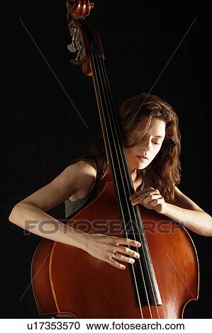 Stock Image - Woman Playing Double Bass. Fotosearch