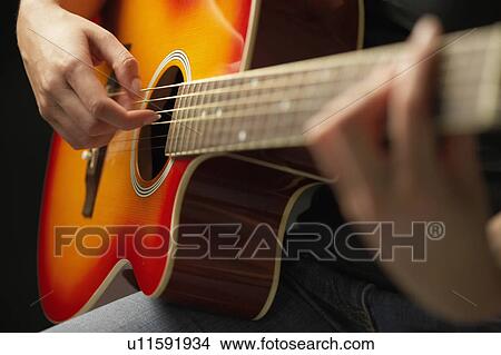 Picture - Woman Playing Guitar, detail, close-up. Fotosearch
