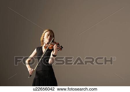 Stock Image - Woman Playing Violin. Fotosearch
