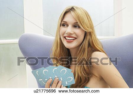 Woman sitting Playing Cards, portrait View Large Photo Image Stock Photograph - Woman sitting Playing Cards, portrait. Fotosearch