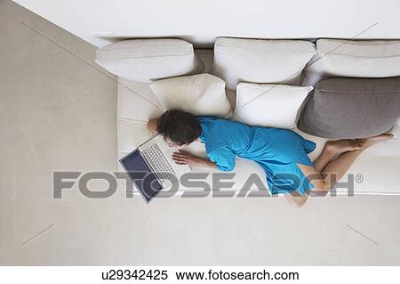 Woman Using Laptop on Sofa View Large Photo Image Stock Photography - Woman Using Laptop on Sofa. Fotosearch