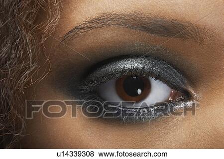 Stock Photo - Woman's Eye with Silver Eye shadow. Fotosearch