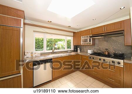 Wooden fitted kitchen units View Large Photo Image Stock Image - Wooden fitted kitchen units. Fotosearch