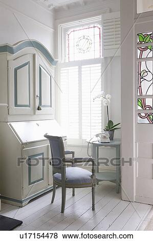 Stock Photo - Writing bureau in study with America shutters, London. Fotosearch
