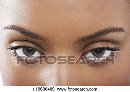 Stock Image - Young black woman's eyes. Fotosearch