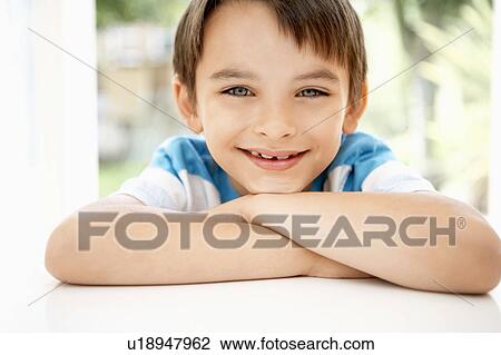 Young boy leaning into window of house, portrait, close up View Large Photo Image Stock Image - Young boy leaning into window of house, portrait, close up. Fotosearch