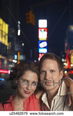 Stock Photo - Young Couple out in city at Night. Fotosearch