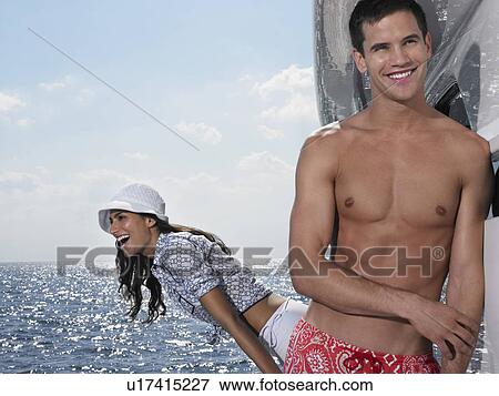 Young couple relaxing on yacht View Large Photo Image Stock Photo - Young couple relaxing on yacht. Fotosearch