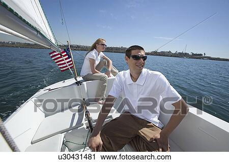 Young couple sailing View Large Photo Image Stock Image - Young couple sailing. Fotosearch
