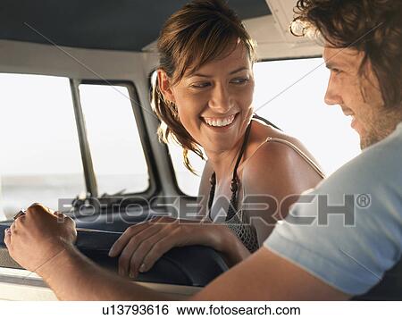Young couple sitting in van, head and shoulders View Large Photo Image Stock Photograph - Young couple sitting in van, head and shoulders. Fotosearch