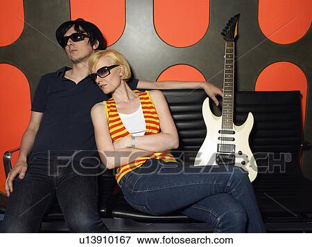Stock Photo - Young couple with guitar, portrait. Fotosearch