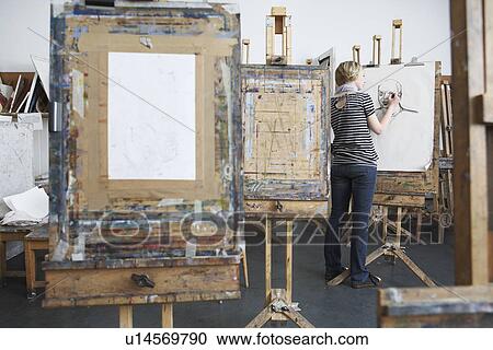 Young female student drawing with charcoal in college art studio View Large Photo Image Stock Image - Young female student drawing with charcoal in college art studio. Fotosearch