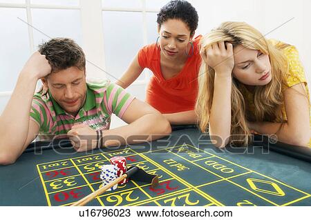 Young man at roulette table losing large bet View Large Photo Image Stock Image - Young man at roulette table losing large bet. Fotosearch