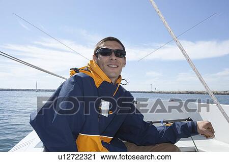 Young man sailing View Large Photo Image Stock Image - Young man sailing. Fotosearch