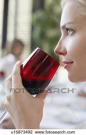 Young woman drinking from wineglass, close-up, profile View Large Photo Image Stock Image - Young woman drinking from wineglass, close-up, profile. Fotosearch