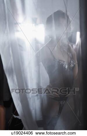 Young woman in black underwear viewed througfh gauze View Large Photo Image Stock Photograph - Young woman in black underwear viewed througfh gauze. Fotosearch