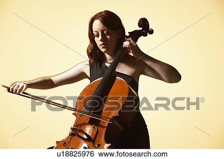 Stock Photograph - Young Woman Playing Cello. Fotosearch