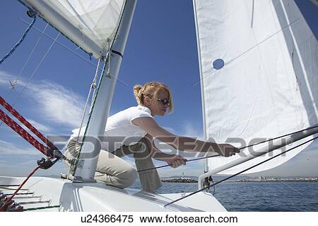 Young woman sailing View Large Photo Image Stock Photography - Young woman sailing. Fotosearch