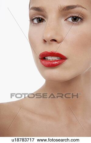 Young woman with lipstick, looking worried View Large Photo Image Stock Photo - Young woman with lipstick, looking worried. Fotosearch