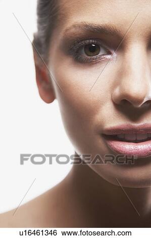 Stock Photograph - Young woman's face, portrait, cropped. Fotosearch
