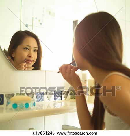 Asian Ethnicity, Brown Hair, Bathroom, Applying View Large Photo Image Stock Photography - Asian Ethnicity, Brown Hair, Bathroom, Applying. Fotosearch