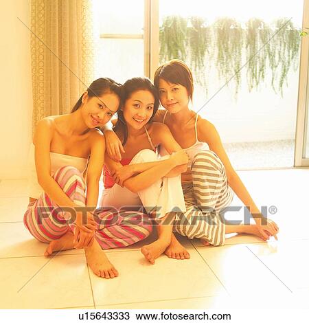 Stock Image - Asian Ethnicity, Casual Clothing, Brown Hair, Barefoot, Adults Only. Fotosearch