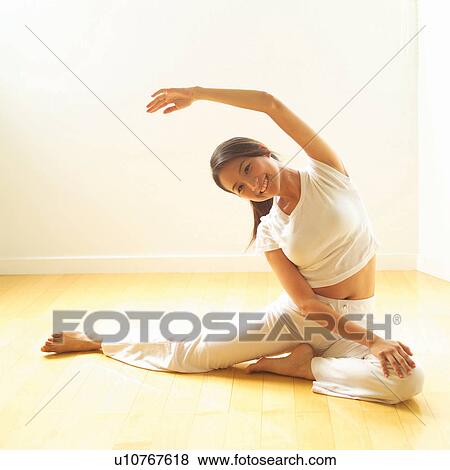 Stock Photo - Asian Ethnicity, Casual Clothing, Brown Hair, Barefoot, Arms Outstretched. Fotosearch