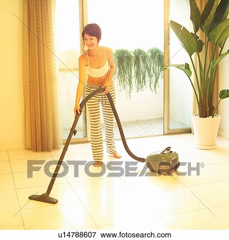 Barefoot, Potted Plant, Indoor, Asian Ethnicity, One Young Woman Only, Toothy Smile, Standing View Large Photo Image Stock Photo - Barefoot, Potted Plant, Indoor, Asian Ethnicity, One Young Woman Only, Toothy Smile, Standing. Fotosearch
