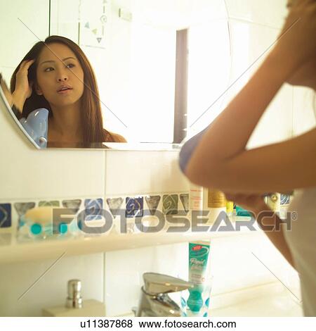 Bathroom, Hand In Hair, Brown Hair, Asian Ethnicity View Large Photo Image Stock Photo - Bathroom, Hand In Hair, Brown Hair, Asian Ethnicity. Fotosearch