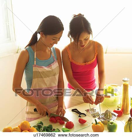 Brown Hair, Asian Ethnicity, Domestic Kitchen, Cutting, Tank Top, Young Women View Large Photo Image Stock Image - Brown Hair, Asian Ethnicity, Domestic Kitchen, Cutting, Tank Top, Young Women. Fotosearch