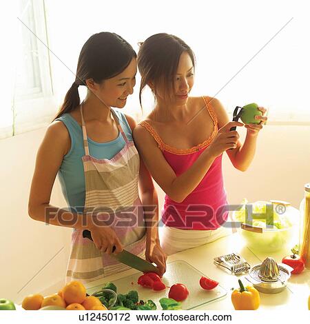 Stock Image - Cheerful, Apron, Casual Clothing, Brown Hair, Asian Ethnicity, Adults Only. Fotosearch