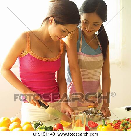 Cheerful, Apron, Casual Clothing, Brown Hair, Asian Ethnicity, Adults Only View Large Photo Image Stock Photo - Cheerful, Apron, Casual Clothing, Brown Hair, Asian Ethnicity, Adults Only. Fotosearch